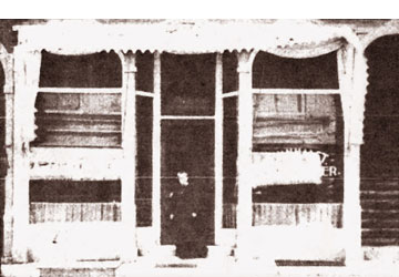 Belle Van Halst in front of their first location on East Main Street, 1906.